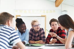 students having a conversation about school work